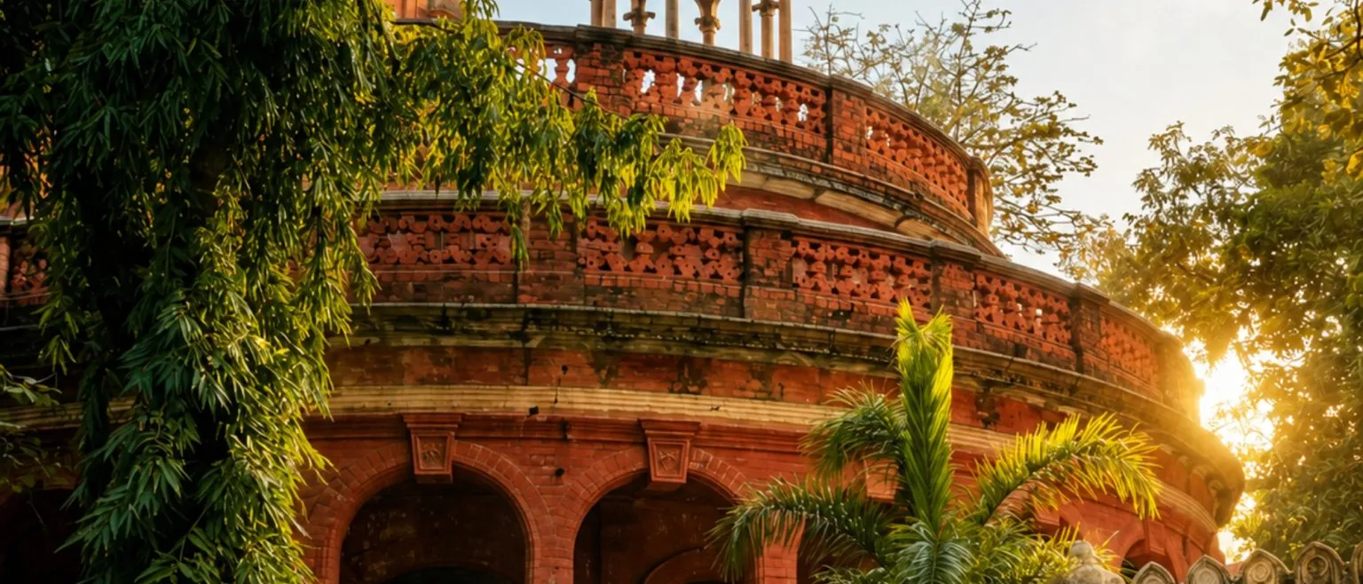 The red-brick Indo-Saracenic facade of a historic city museum, with arches and small domes.